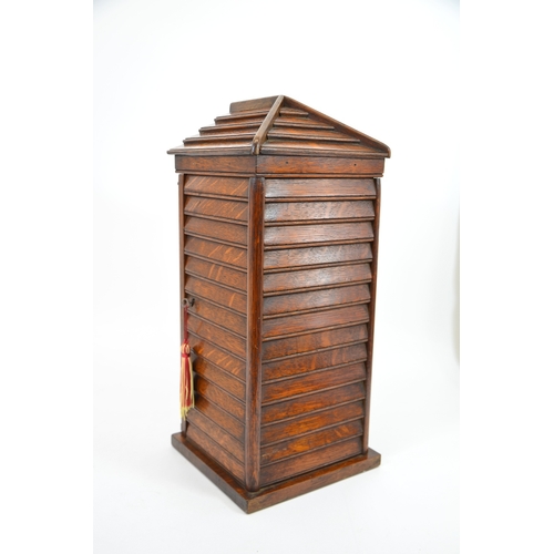 96 - A Victorian Country House oak letter box, in the form of a sentry box, the glazed door painted with ... 