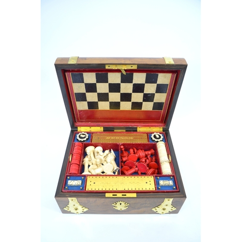 99 - A Victorian olive wood games compendium, circa 1875, brass banded with a matching ornate escutcheon,... 