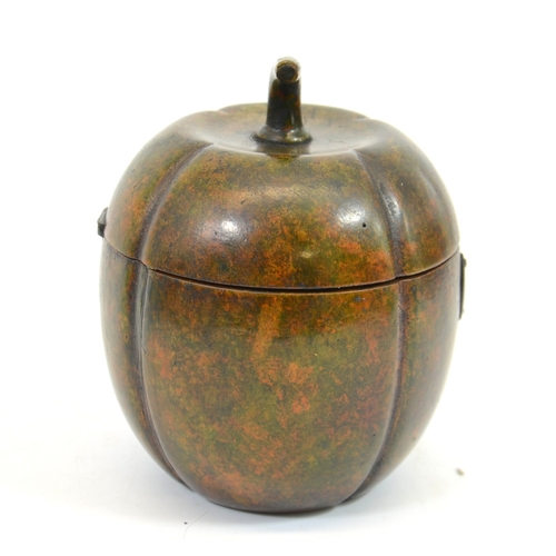 106 - A George III fruitwood melon form tea caddy, with white metal escutcheon, lobed ovoid form with stem... 