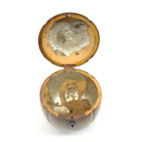 106 - A George III fruitwood melon form tea caddy, with white metal escutcheon, lobed ovoid form with stem... 