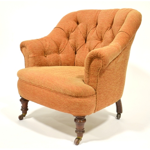 122 - A Victorian upholstered gentlemans club arm chair, on turned legs, casters