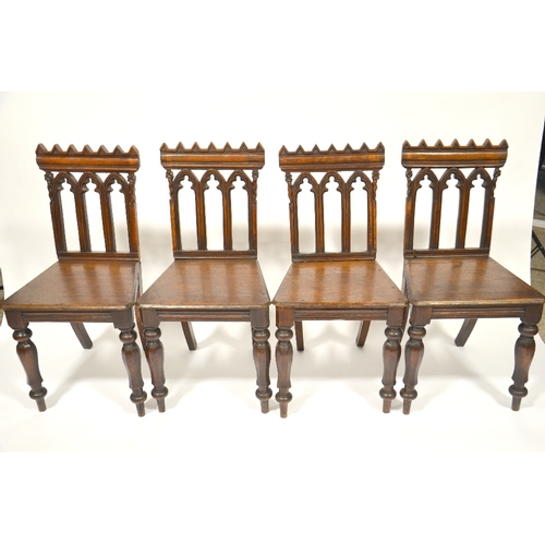 123 - A set of four William IV Gothic Revival oak hall chairs, circa 1835, octagonal baluster legs support... 