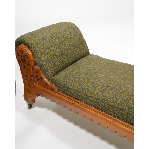 142 - Charles Bevan (attributed), a Gothic Revival pine chaise longue, double column legs and carved crene... 