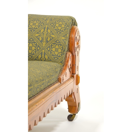 142 - Charles Bevan (attributed), a Gothic Revival pine chaise longue, double column legs and carved crene... 