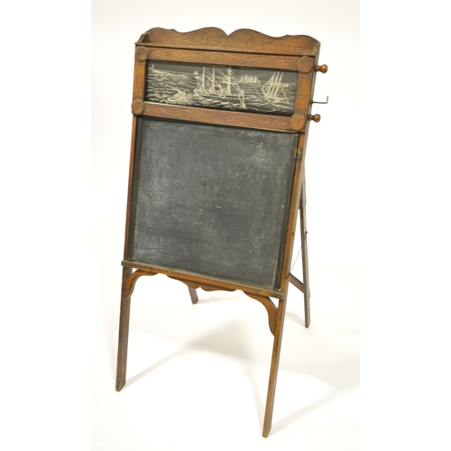 159 - An American Arts and Crafts easel back blackboard, with scrolling chart including music, shorthand, ... 