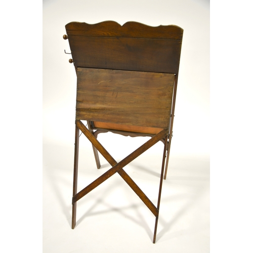 159 - An American Arts and Crafts easel back blackboard, with scrolling chart including music, shorthand, ... 