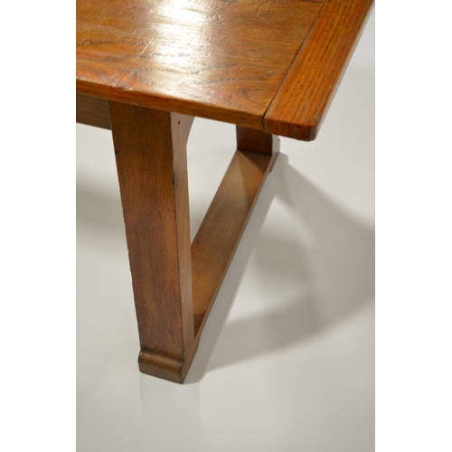 166 - Ambrose Heal for Heal and Sons, an Arts and Crafts oak Letchworth refectory table, three plank top w... 