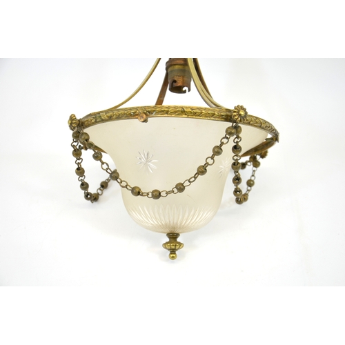 242 - An Edwardian brass and glass pendant light fitting, with domed and star cut frosted shade,