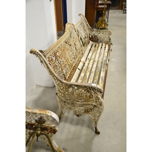 193 - A Victorian cast iron three seat garden bench, attributed to Coalbrookdale, fern and lily of the val... 