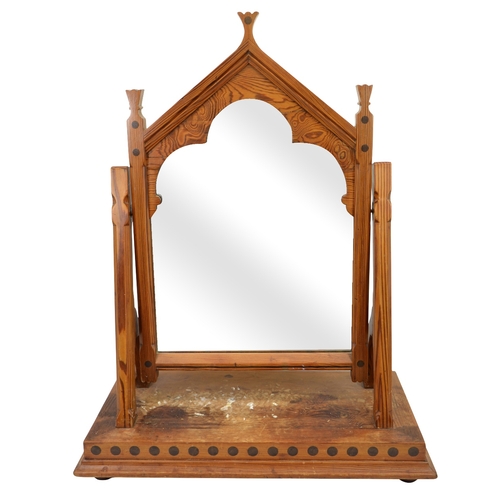 141 - Charles Bevan (attributed), a Gothic Revival pine swing toilet mirror, the triangular arched frame w... 