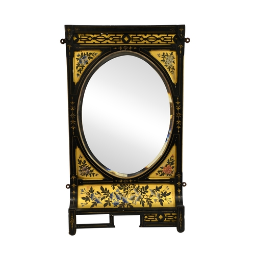 146 - An Aesthetic Movement ebonised mirror, circa 1880, painted with gilt backed floral motifs and blind ... 