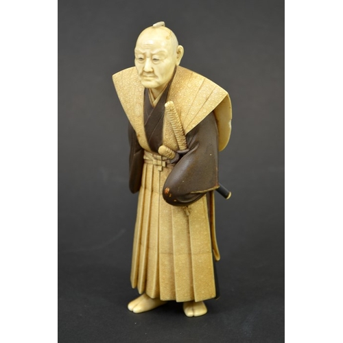 47 - λ A 19th century Japanese ivory okimono of an old Samurai warrior, Meiji, painted and carved with sh... 