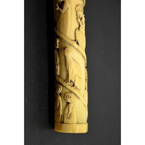 65 - λ A 19th century African tribal carved tusk, decorated with a spiral of African figures in European ... 