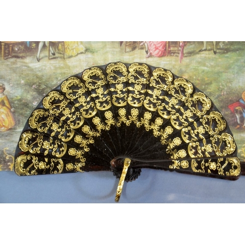 76 - A 19th century mother of pear and silver overlay fan, the leaf painted with 18th century courting sc... 