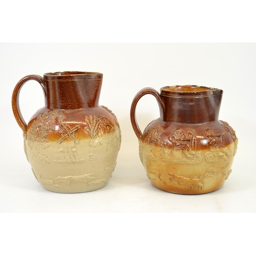 1318 - Two 19th century salt glazed stoneware hunting jugs, sprigged with tavern scenes, 19.5cm high (2)