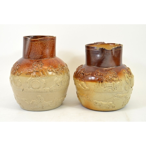 1318 - Two 19th century salt glazed stoneware hunting jugs, sprigged with tavern scenes, 19.5cm high (2)