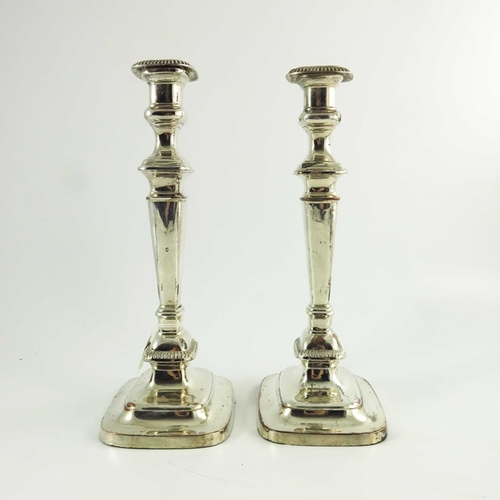 1 - A pair of George III Old Sheffield Plate candlesticks, circa 1800, rounded rectangular section, step... 