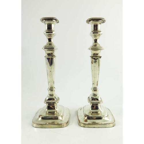 1 - A pair of George III Old Sheffield Plate candlesticks, circa 1800, rounded rectangular section, step... 