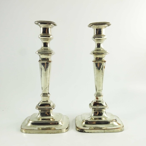 1 - A pair of George III Old Sheffield Plate candlesticks, circa 1800, rounded rectangular section, step... 