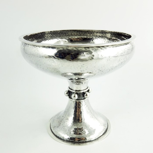 101 - A E Jones, an Arts and Crafts silver tazza or pedestal bowl, Birmingham 1911, planished finish, the ... 