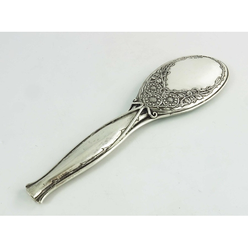 103 - Omar Ramsden and Alwyn Carr, an Arts and Crafts silver hand mirror, London 1915, the oval head embos... 