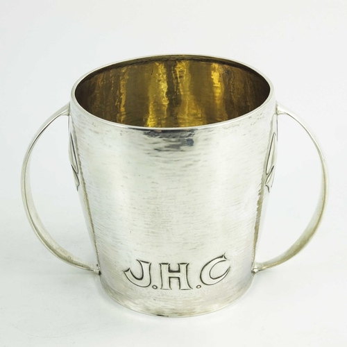 106 - Archibald Knox for Liberty and Co., an Arts and Crafts silver twin handled cup, Birmingham 1907, mod... 