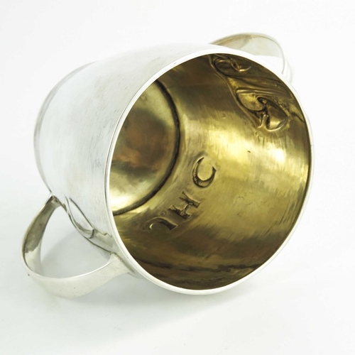 106 - Archibald Knox for Liberty and Co., an Arts and Crafts silver twin handled cup, Birmingham 1907, mod... 