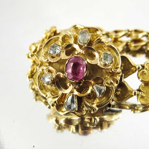 130 - A Victorian gold, diamond and ruby bracelet, the cast heart linked double chain band with foliate sc... 