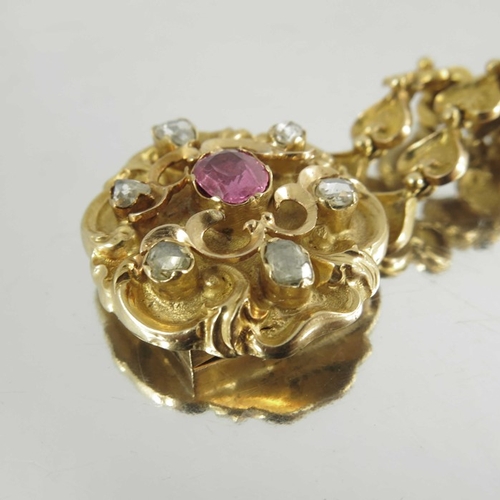 130 - A Victorian gold, diamond and ruby bracelet, the cast heart linked double chain band with foliate sc... 