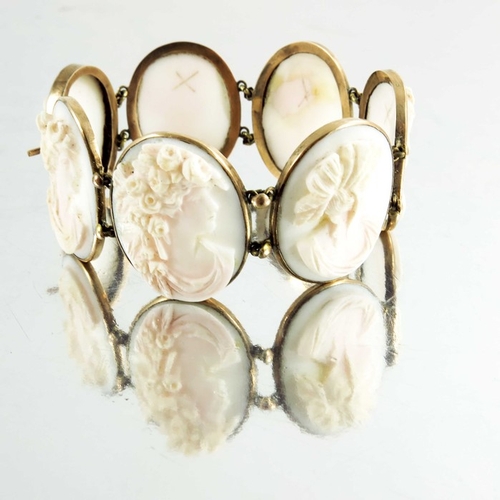 131 - A Victorian yellow metal and cameo set bracelet, seven portrait ovals of Classical women in profile ... 