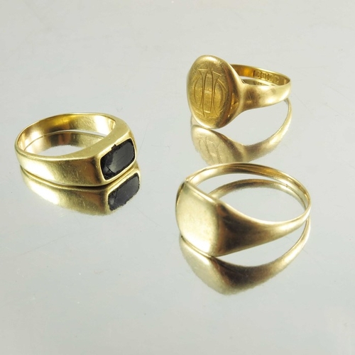 137 - Two signet gold rings, one 15ct, together with yellow metal ring, weight of two marked rings approx ... 