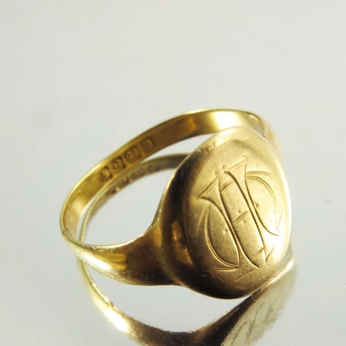 137 - Two signet gold rings, one 15ct, together with yellow metal ring, weight of two marked rings approx ... 