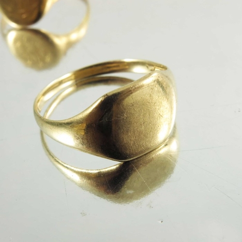 137 - Two signet gold rings, one 15ct, together with yellow metal ring, weight of two marked rings approx ... 