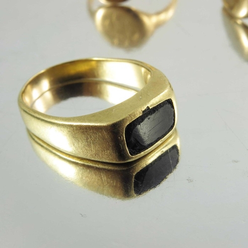 137 - Two signet gold rings, one 15ct, together with yellow metal ring, weight of two marked rings approx ... 