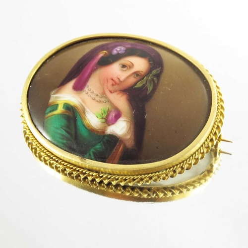 139 - A Victorian Porcelain Brooch mounted in 15ct yellow gold, the oval lozenge depicting a portrait imag... 