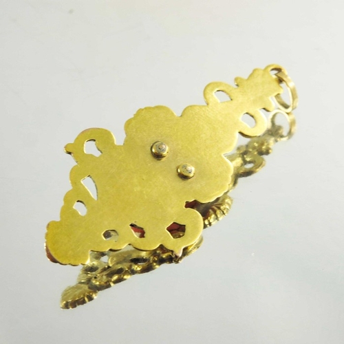 140 - A Victorian Yellow Gold Drop Pendant with carved coral Romanesque bust, in Rococo style the bust sec... 