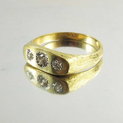 142 - A Gentleman's 18ct yellow gold three stone diamond ring, the central old cut diamond surmounted by t... 