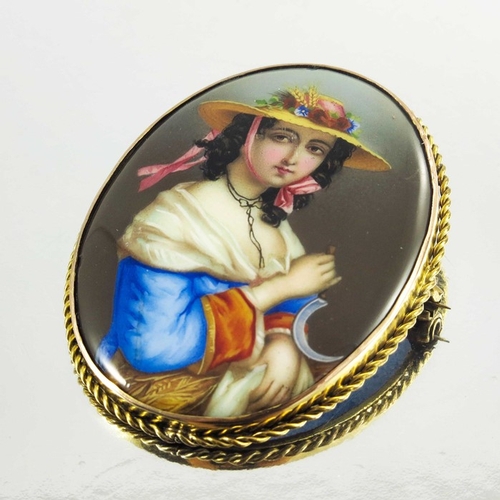 152 - A 9ct yellow gold and enamel oval brooch/pendant, with portrait painted in coloured enamels of a lad... 