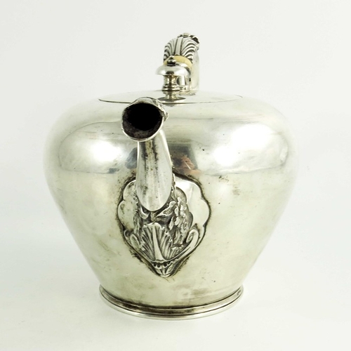 21 - A mid 18th century Scottish provencial silver teaport, circular shape, floral decoration to the spou... 