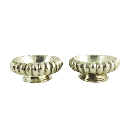 23 - A pair of George III Irish silver salt cellars, Christopher Haines, Dublin 1810, squat reeded form, ... 