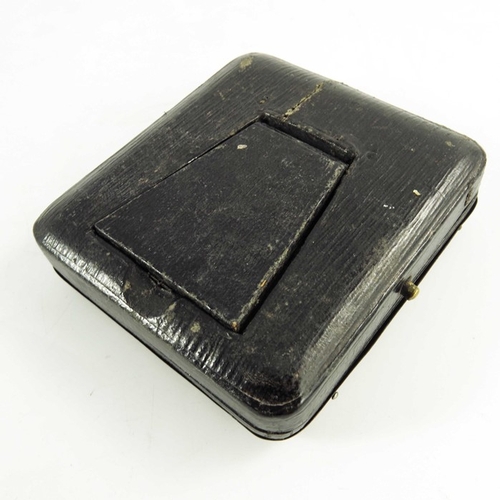 28 - A George V silver watch holder, William Hutton and Sons, Birmingham 1918, cushioned rectangular form... 