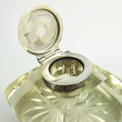 34 - A Victorian silver and glass inkwell, John Grinsell and Sons, London 1897, square section cushion sh... 