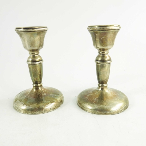 45 - A pair of George V silver dwarf candlesticks, W I Broadway and Co., Birmingham 1931, turned cup and ... 