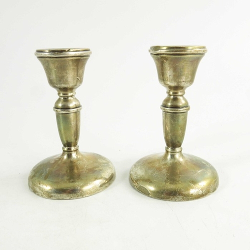 45 - A pair of George V silver dwarf candlesticks, W I Broadway and Co., Birmingham 1931, turned cup and ... 