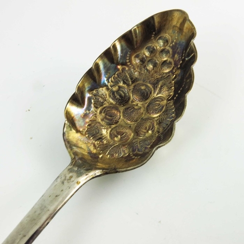 52 - A George III Scottish silver berry spoon, Edinburgh 1812, fiddle pattern, later embossed and gilt be... 