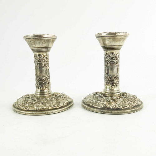 54 - A pair of Elizabeth II silver dwarf candlesticks, W I Broadway and Co., Birmingham 1969, heavily emb... 