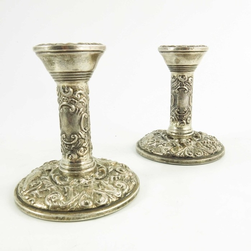 54 - A pair of Elizabeth II silver dwarf candlesticks, W I Broadway and Co., Birmingham 1969, heavily emb... 