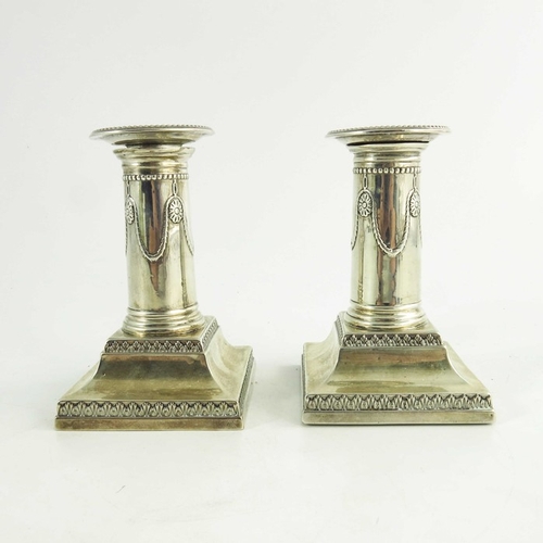 61 - A pair of Victorian silver dwarf candlesticks, Goldsmiths and Silversmiths Co., London 1900, Neoclas... 