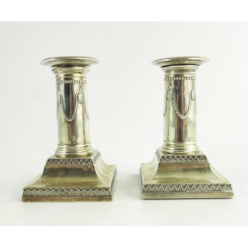 61 - A pair of Victorian silver dwarf candlesticks, Goldsmiths and Silversmiths Co., London 1900, Neoclas... 