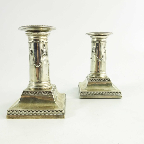 61 - A pair of Victorian silver dwarf candlesticks, Goldsmiths and Silversmiths Co., London 1900, Neoclas... 